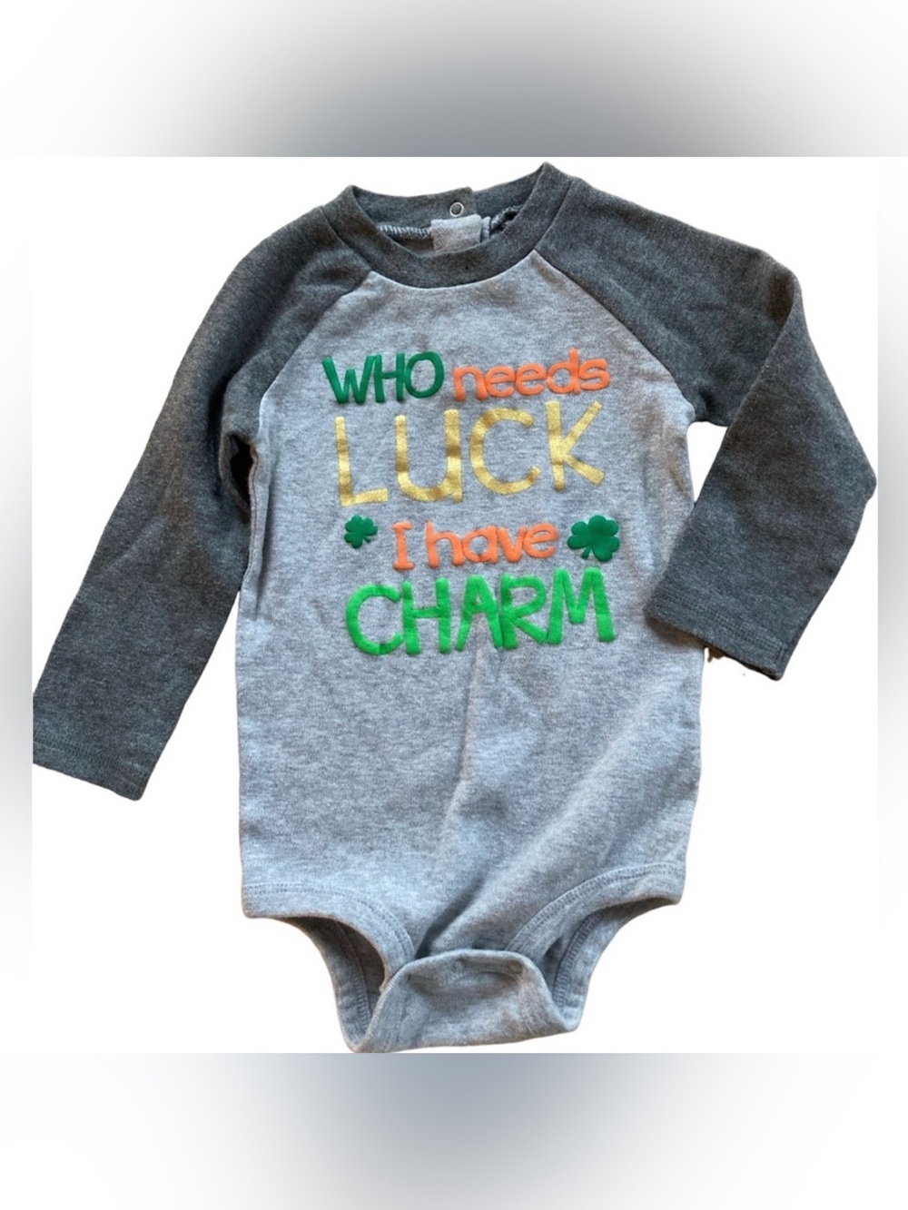 St Patrick’s Koala Kids baby bodysuit with text "WHO needs LUCK I have CHARM”